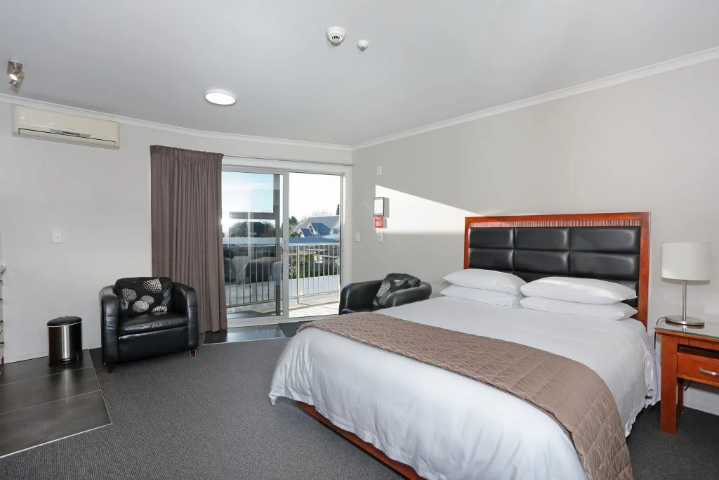 Queen bed in the Corporate One Bedroom living area